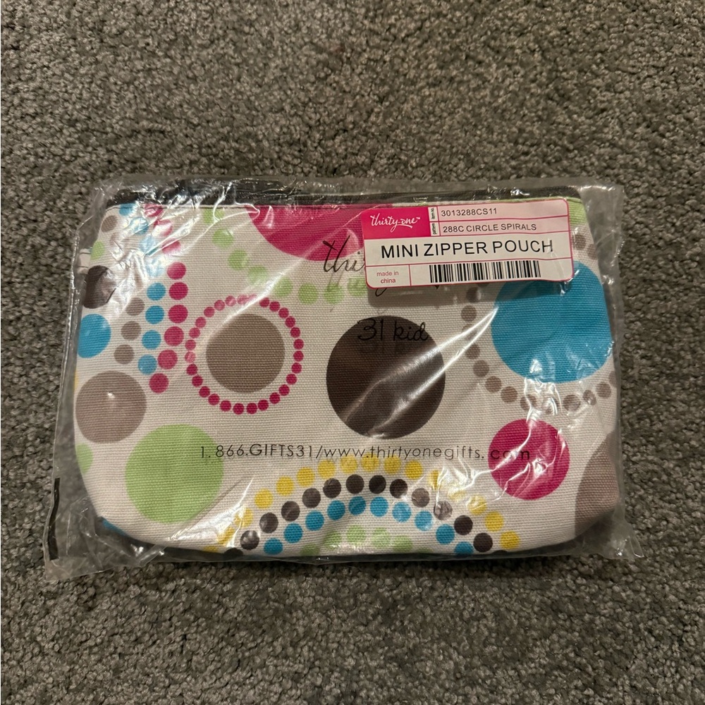Brand new Thirty-One Mini Zipper Pouch in Circle Spirals